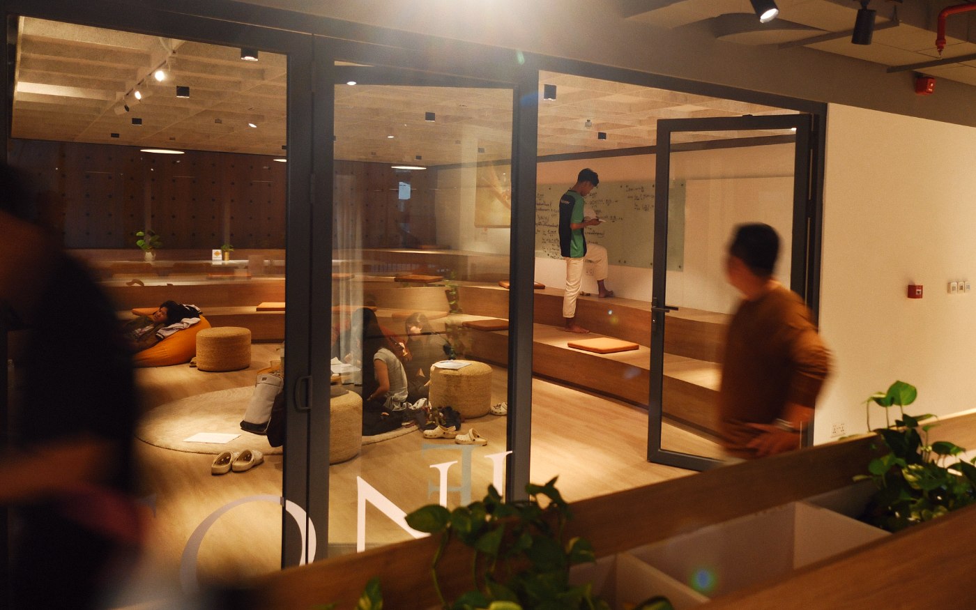 Tonle through its glass doors, tiered seating, floor cushions and a glass whiteboard