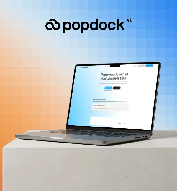 Popdock AI website on a laptop