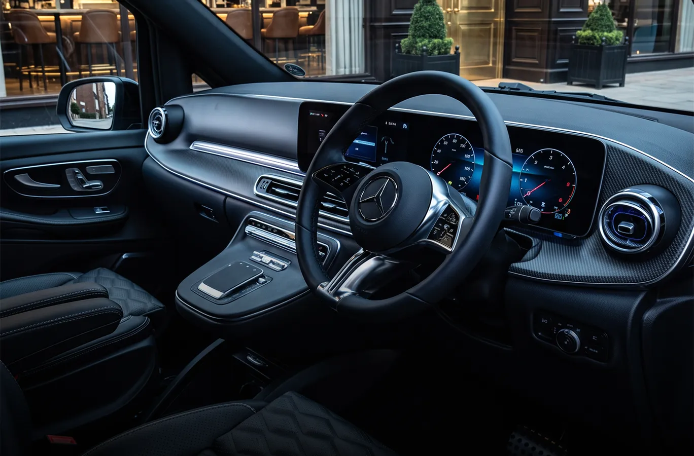 Mercedes interior overlooking a city destination