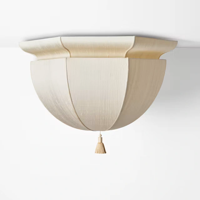 Workstead’s Lantern Demi Large shown alone, revealing its curved silk shade and tassel.