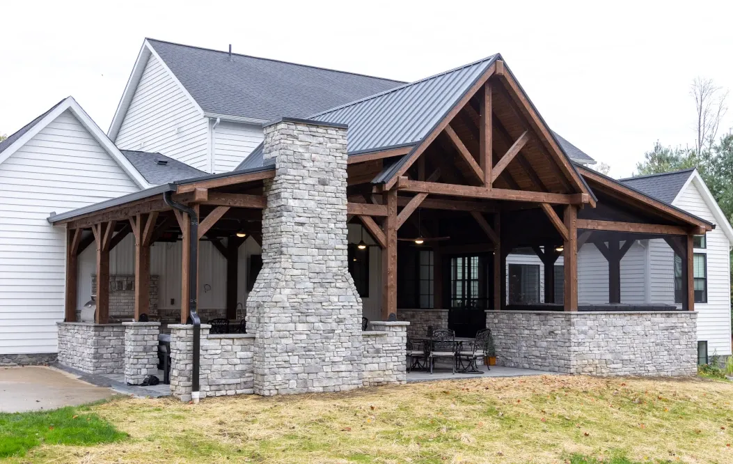 large outdoor room timber framing and stone walls