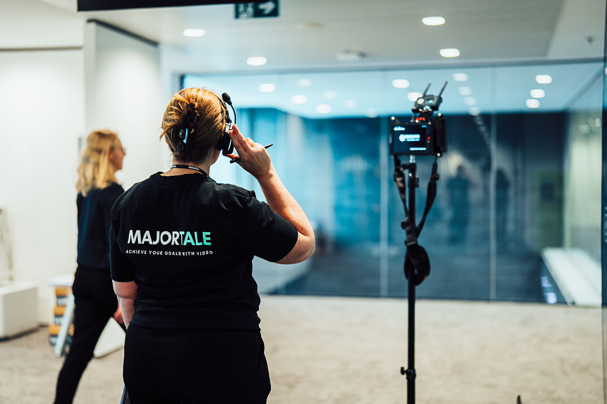 Majortale crew member setting up a camera in an office