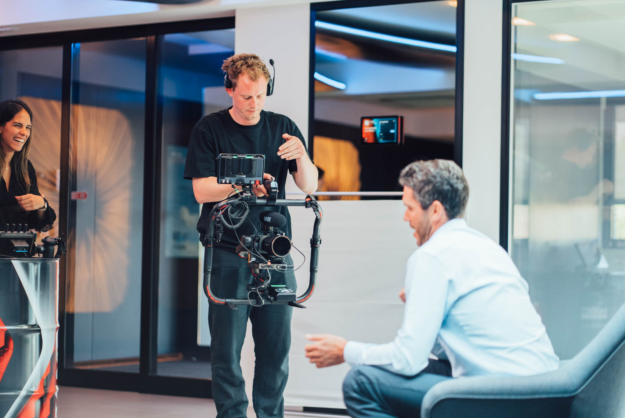 Majortale camera operator filming an interview in a showroom