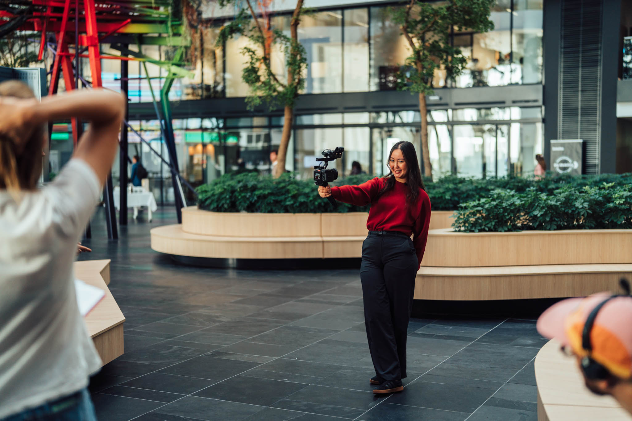 Deloitte graduate self-shooting in the Gateway building atrium