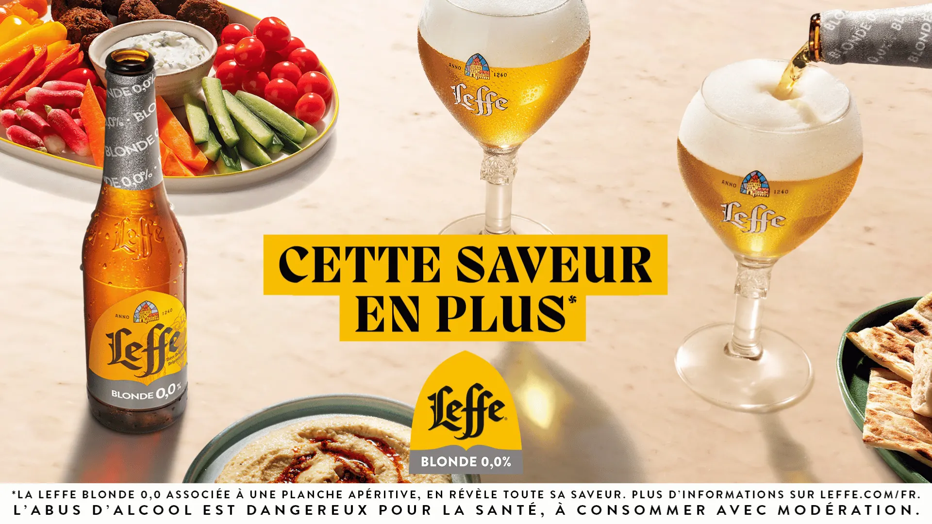 Leffe Blonde 0.0 bottle and glasses with snacks, French print ad