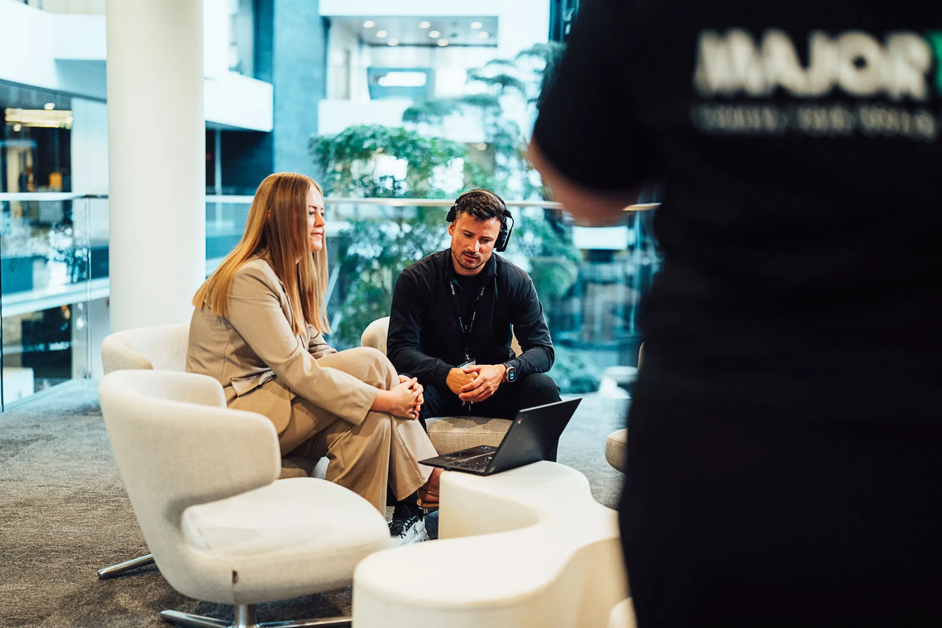 Majortale crew interviewing a woman in a lounge area