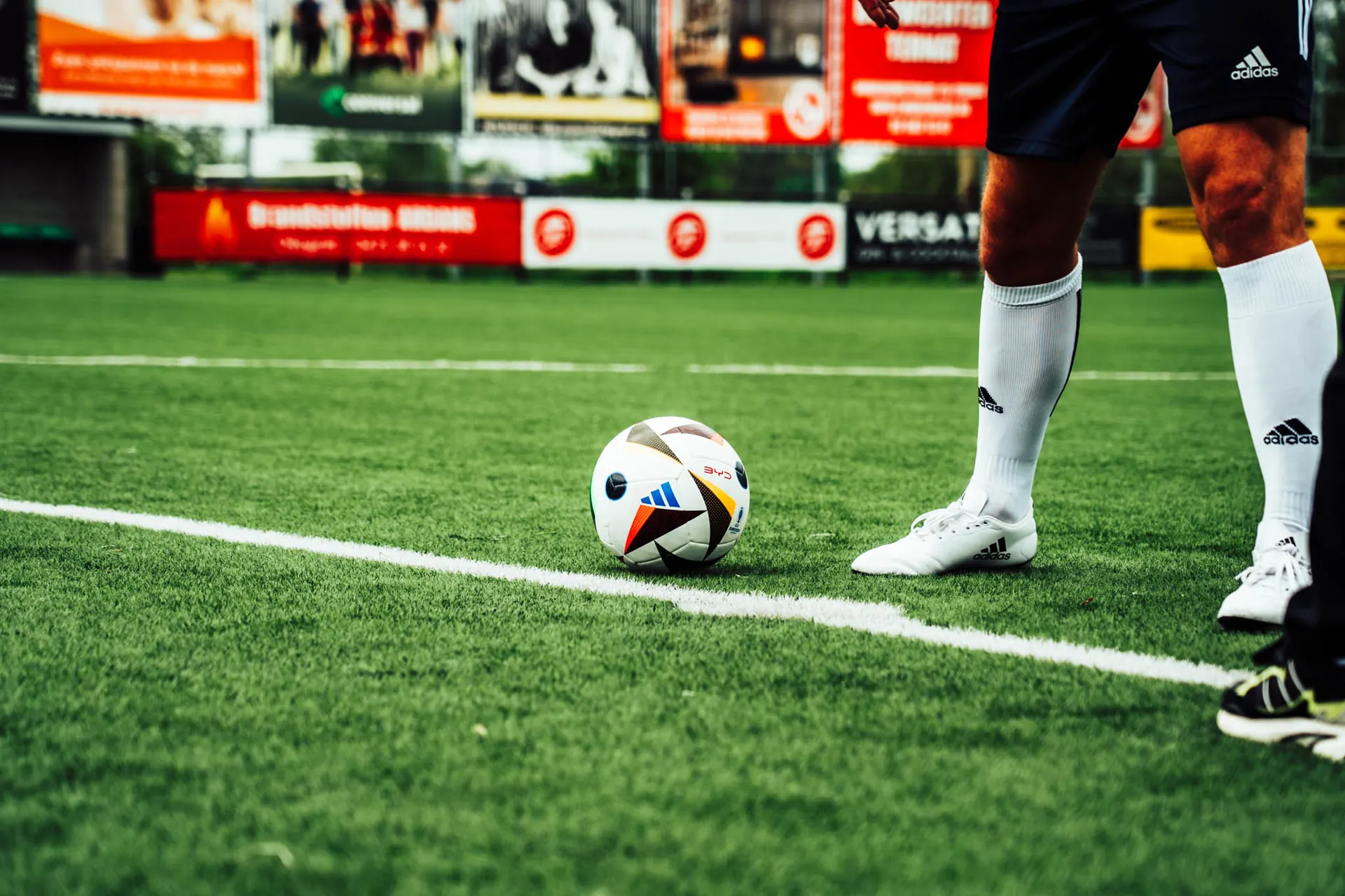 Footballer's feet next to a ball on the pitch, BYD Euro Cup campaign