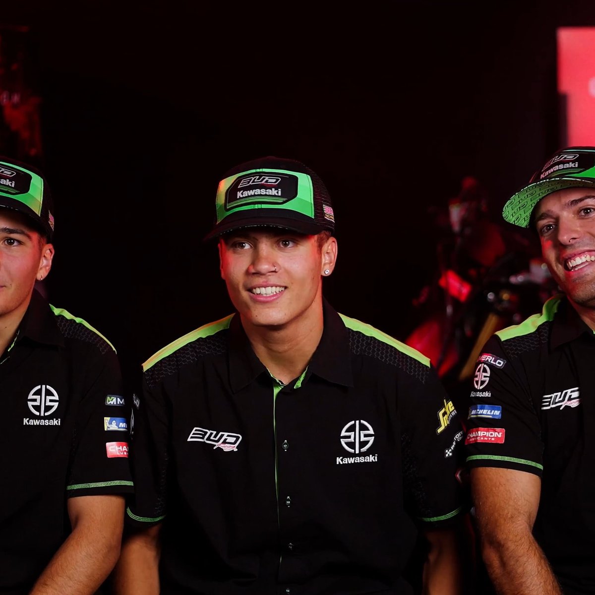 BUD Racing riders in team shirts during a Champion Lubricants interview