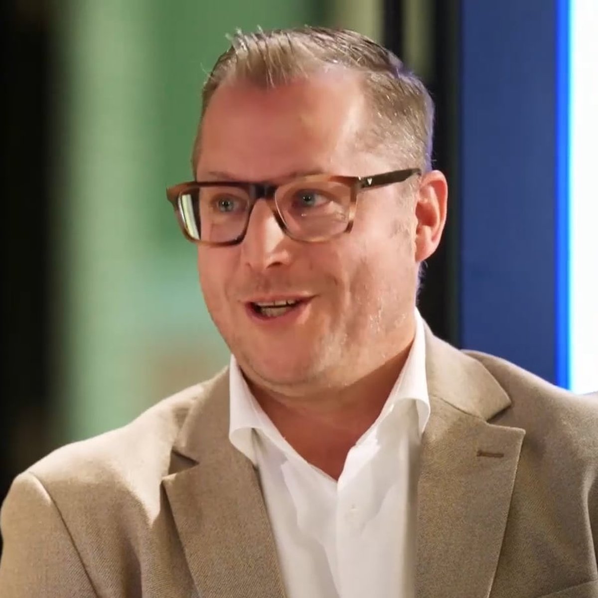 Bank van Breda manager in a beige blazer during an interview