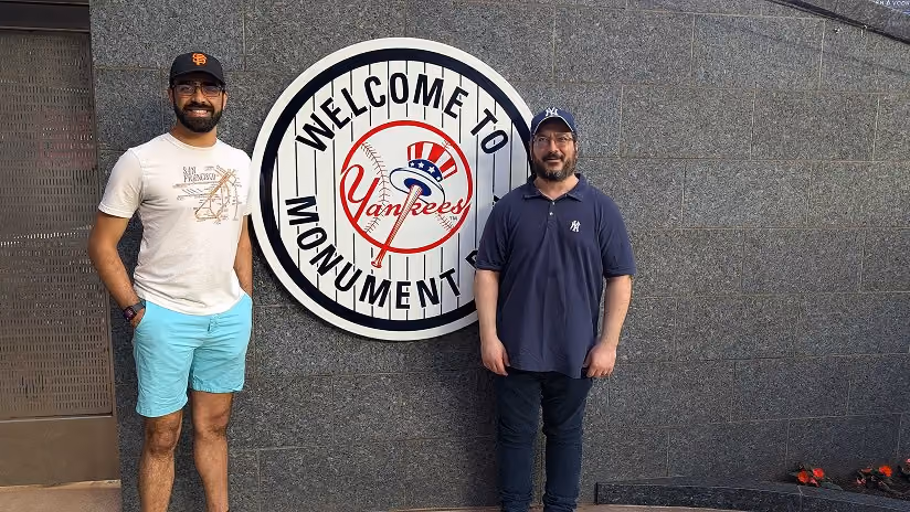 Two Affiniti team members at Yankee Stadium's Monument Park