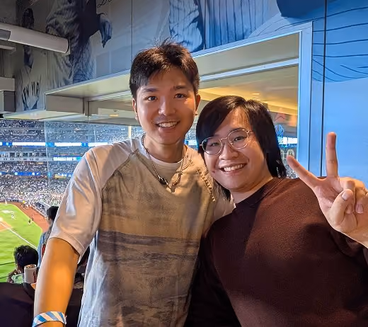 Two Affiniti team members at a baseball game