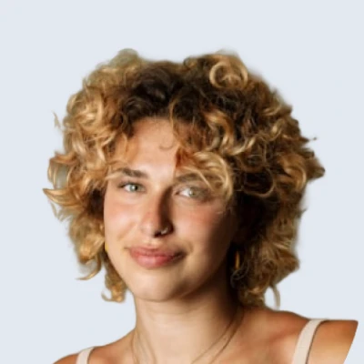 Portrait of a woman with short curly hair.
