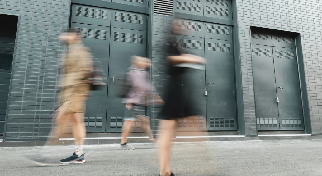 Pedestrians walking along a city street.