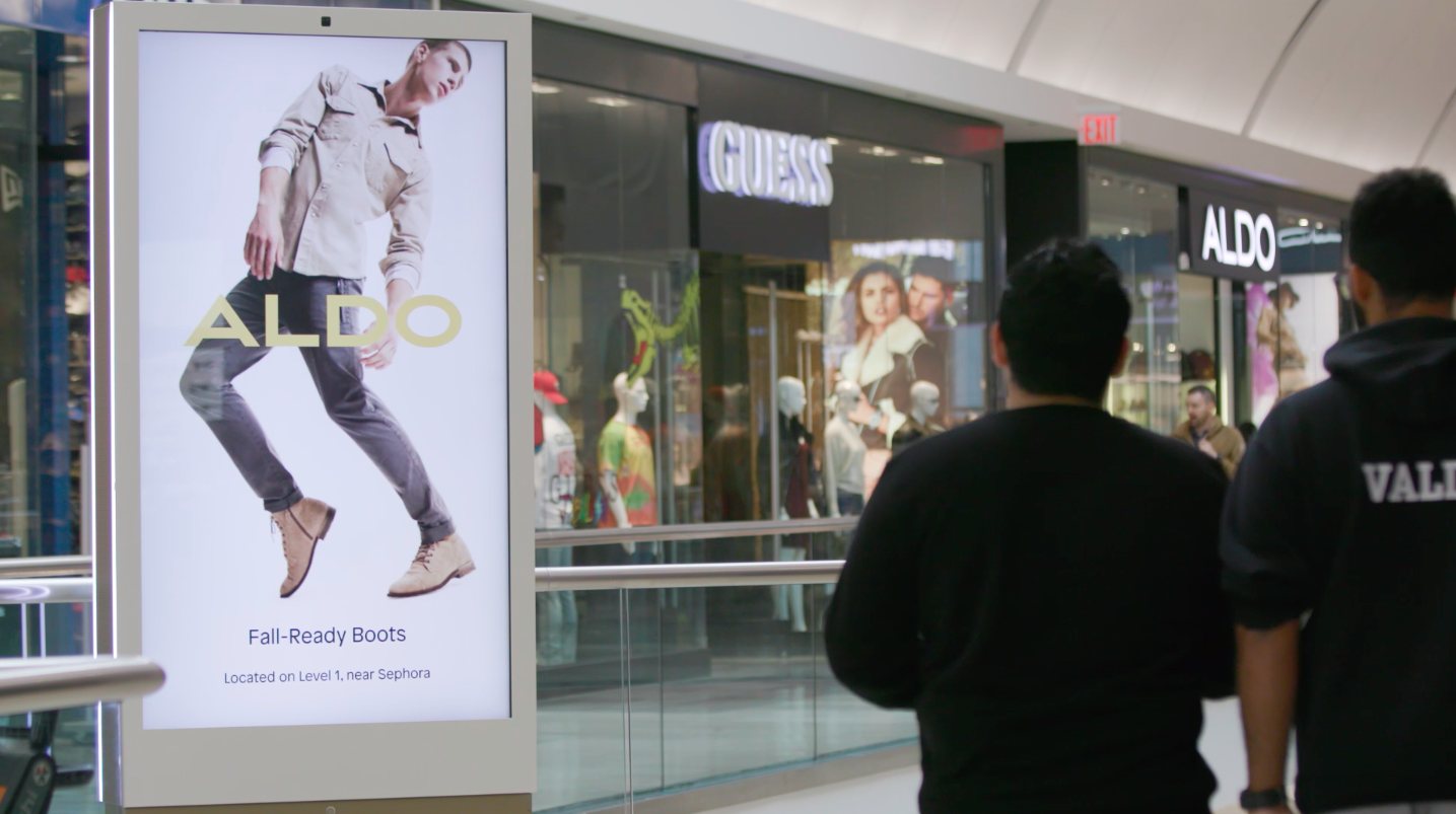 Aldo ad on a URW Network screen next to the Aldo store
