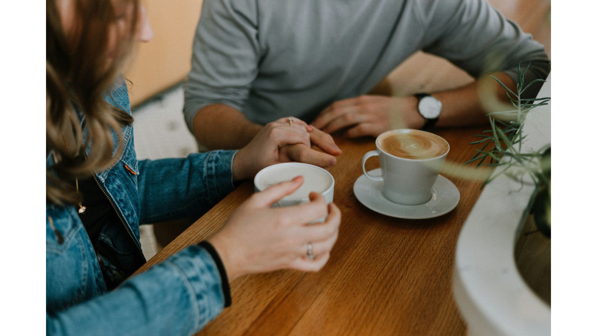 A couple talking over coffee