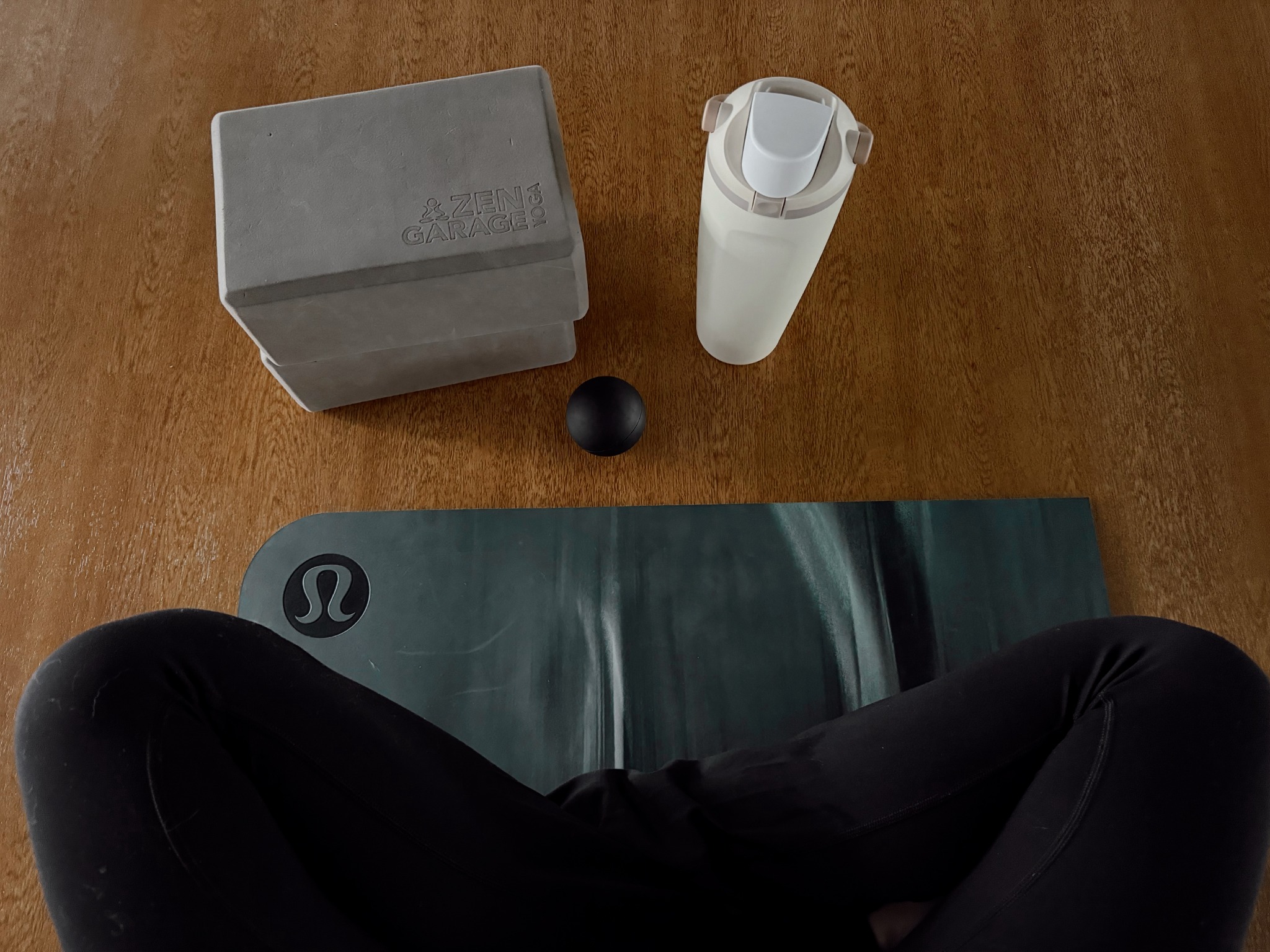 Yoga mat, blocks and a water bottle