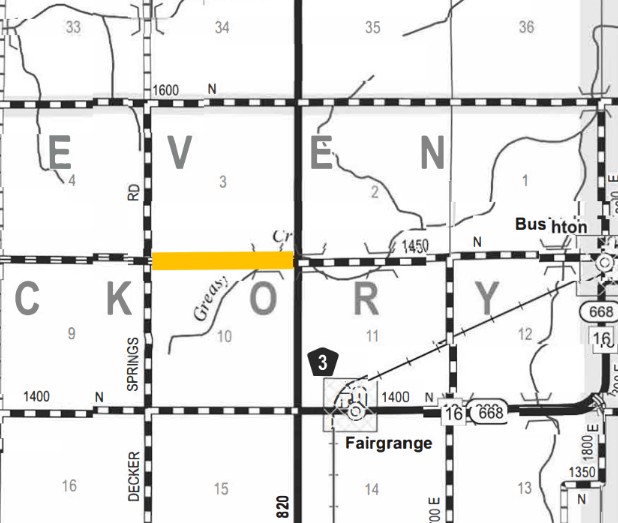 Map showing sections of a rural area with labeled blocks, roads, and highways. Highlights include the orange line marking a road segment between grid blocks. Key locations labeled are Bushton near the top right and Fairgrange near the bottom center. Roads labeled with numbers and names such as Springs Rd, Decker, and highways 16, 668, and 3 are displayed. Grid numbers 1 to 16 designate different blocks.