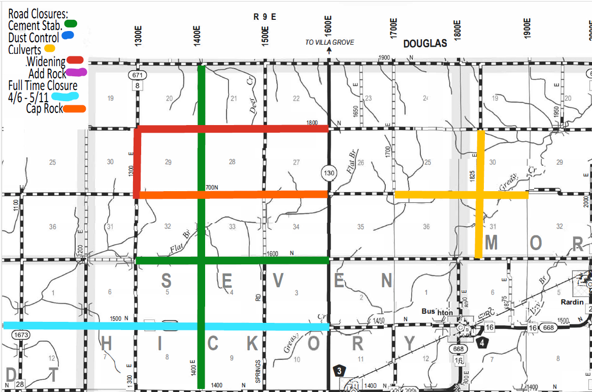 Map showing road closures and maintenance in a grid layout with roads marked by colors representing types of work: green for cement stabilization, blue for dust control, yellow for culverts, red for widening, purple for adding rock, light blue for full-time closure April 6 to May 11, and orange for cap rock. The map includes labeled roads and highways, section numbers, and locations like Douglas and Hickory. Key roads run vertically and horizontally with grid numbers and landmarks like Bushton and Rardin noted.