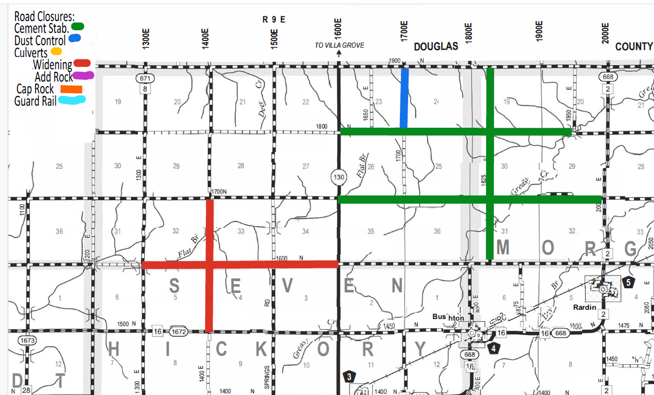 Road map showing various road closures with a legend indicating colors for Cement Stabilization (green), Dust Control (blue), Culverts (yellow), Widening (red), Add Rock (purple), Cap Rock (orange), and Guard Rail (light blue). Roads in areas labeled SEVEN and MORGAN have closures with thick lines in these colors, including green cement stabilization lines running vertically and horizontally, a blue dust control vertical line in Douglas county, and a red widening cross in SEVEN area.