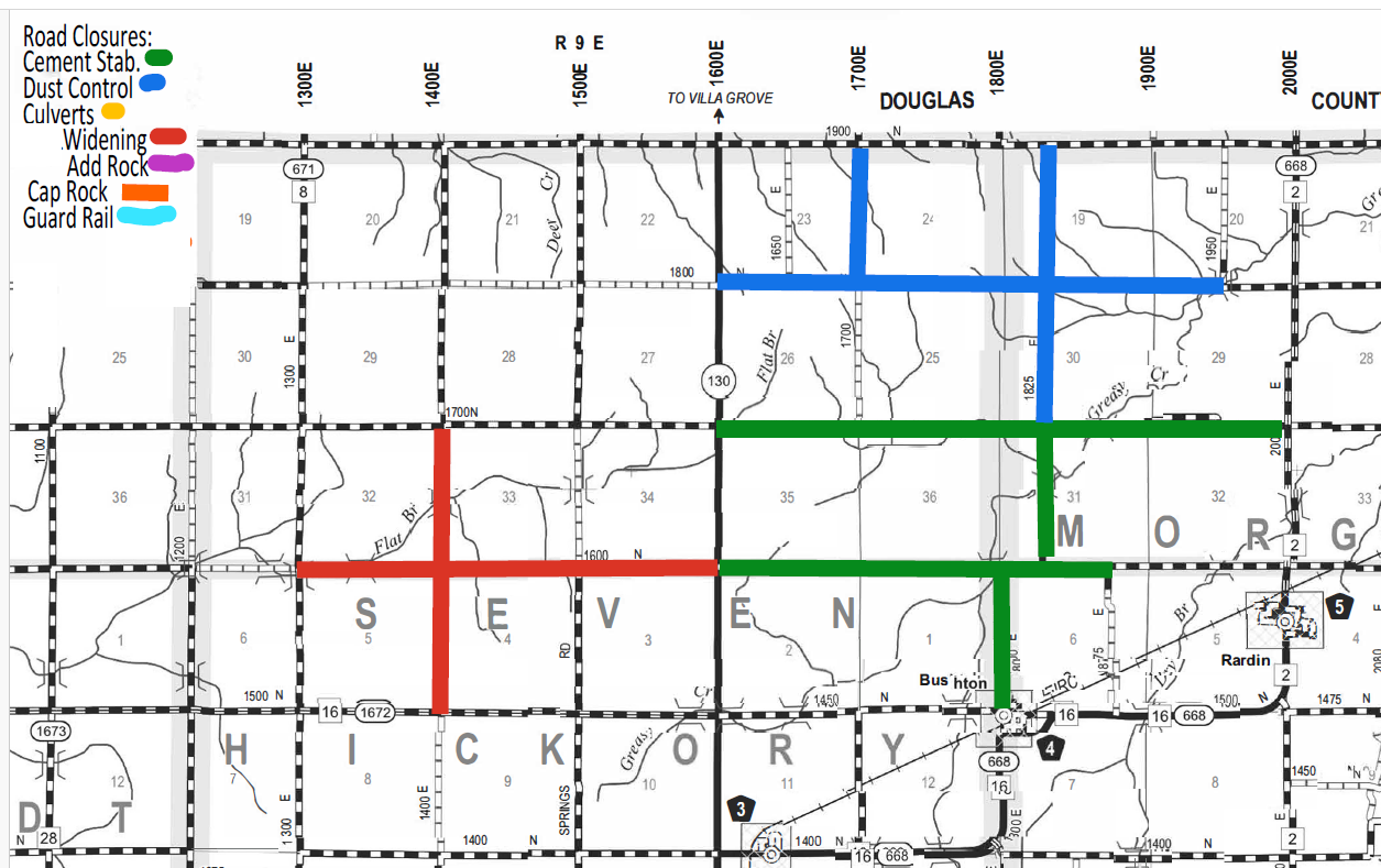 Map showing road closures with color-coded lines: green for cement stabilization on east-west and north-south roads in the central areas, blue for dust control on roads in the upper right section, red for widening forming a cross in the middle left, orange for cap rock on one vertical segment, purple for adding rock on one segment north-central, yellow for culverts, and light blue for guard rails. Labels indicate nearby county lines, highways, roads, and towns like S, E, V, E, N, M, O, R, G, HICKORY, and Rardin.