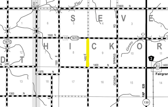 Black and white map showing grid layout with labeled sections and roads; vertical section labeled '1400 E' is highlighted in yellow between sections 8 and 9.