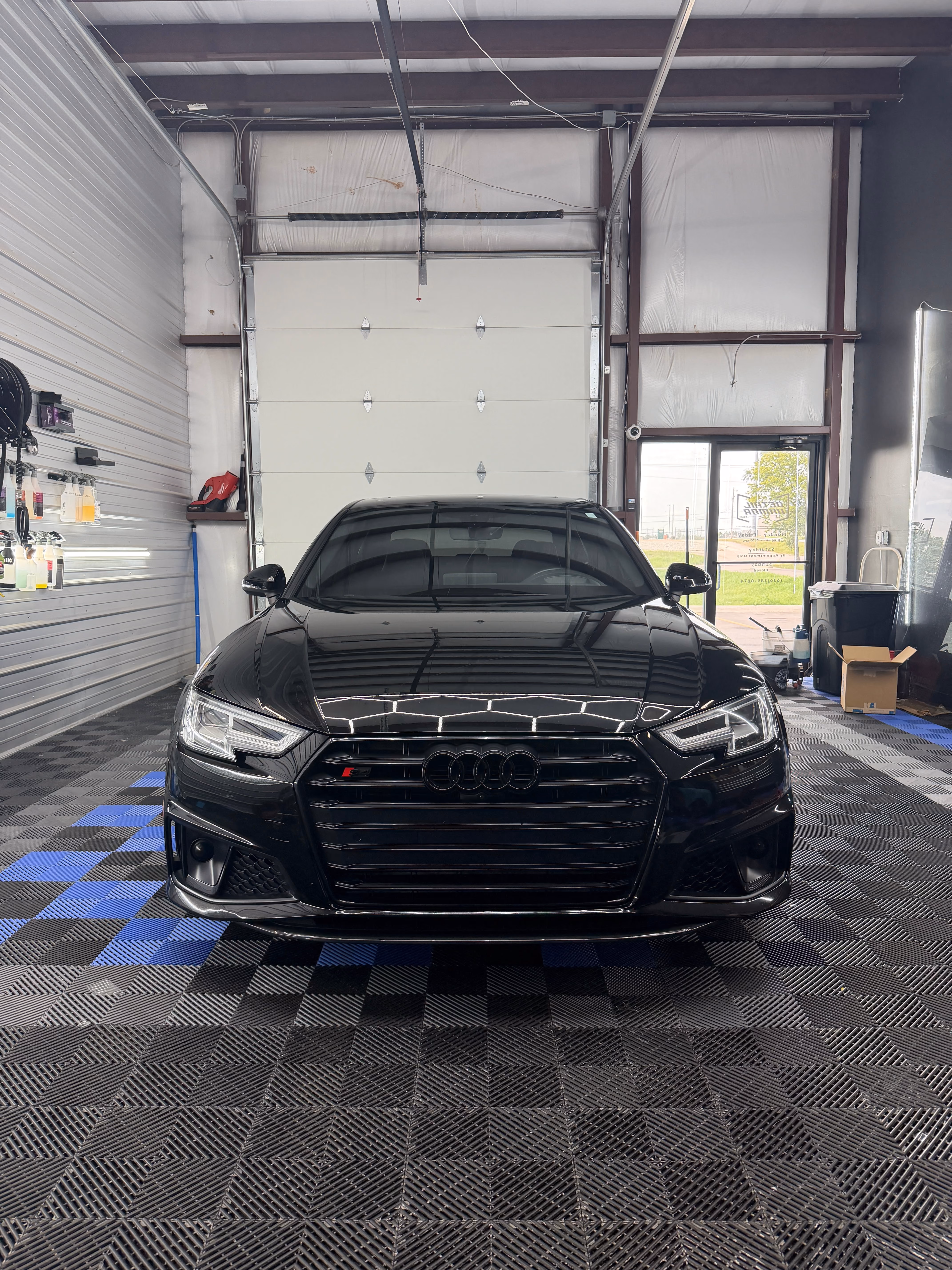 Black Audi with tinted windshield and windows in the Detail Armor studio in Springfield, MO