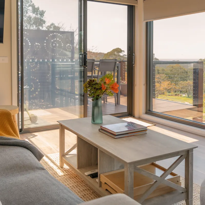 The upstairs lounge, its window wall open to the view