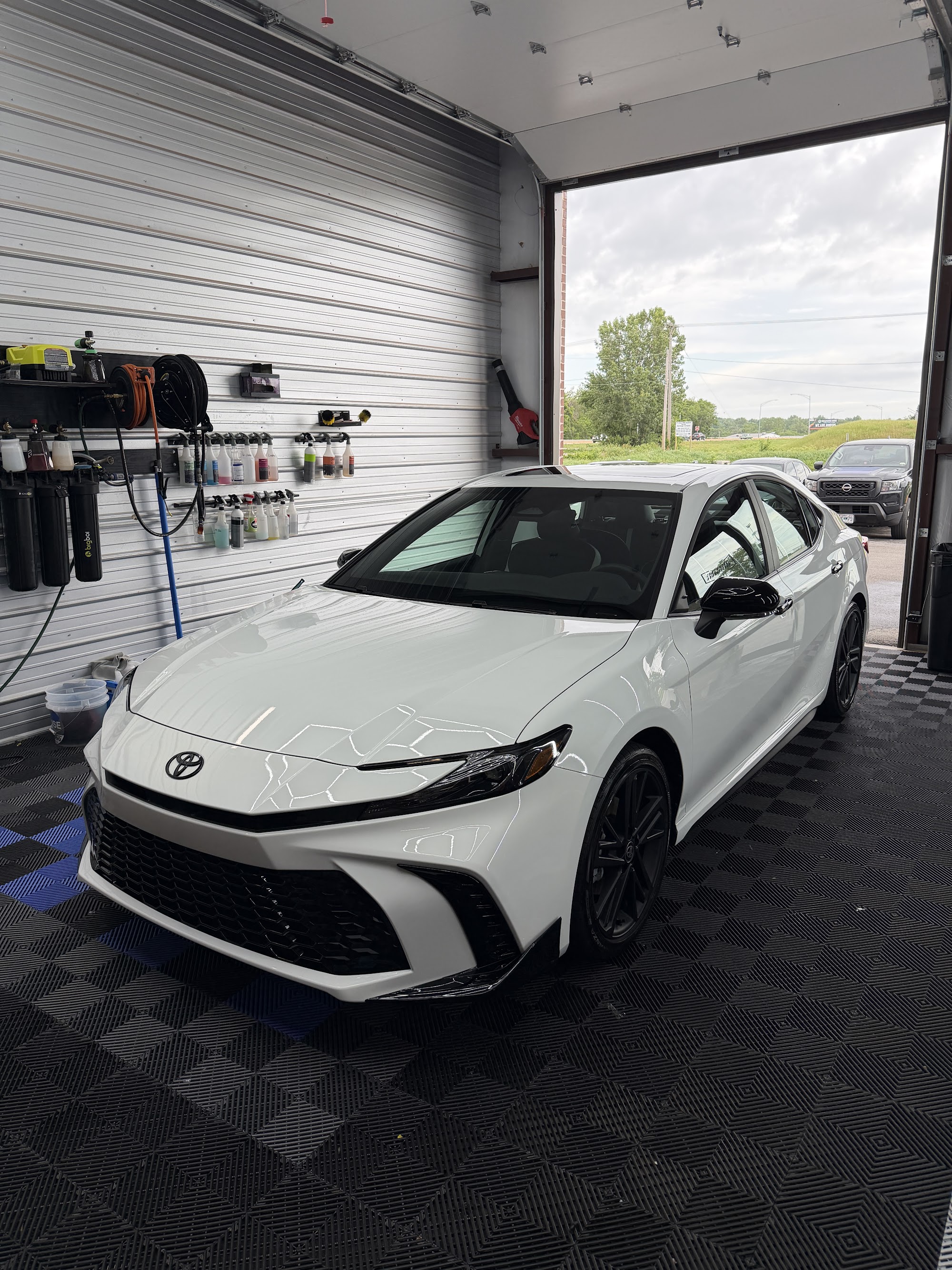 White Toyota Camry with full front paint protection film and a ceramic coating in the Detail Armor studio
