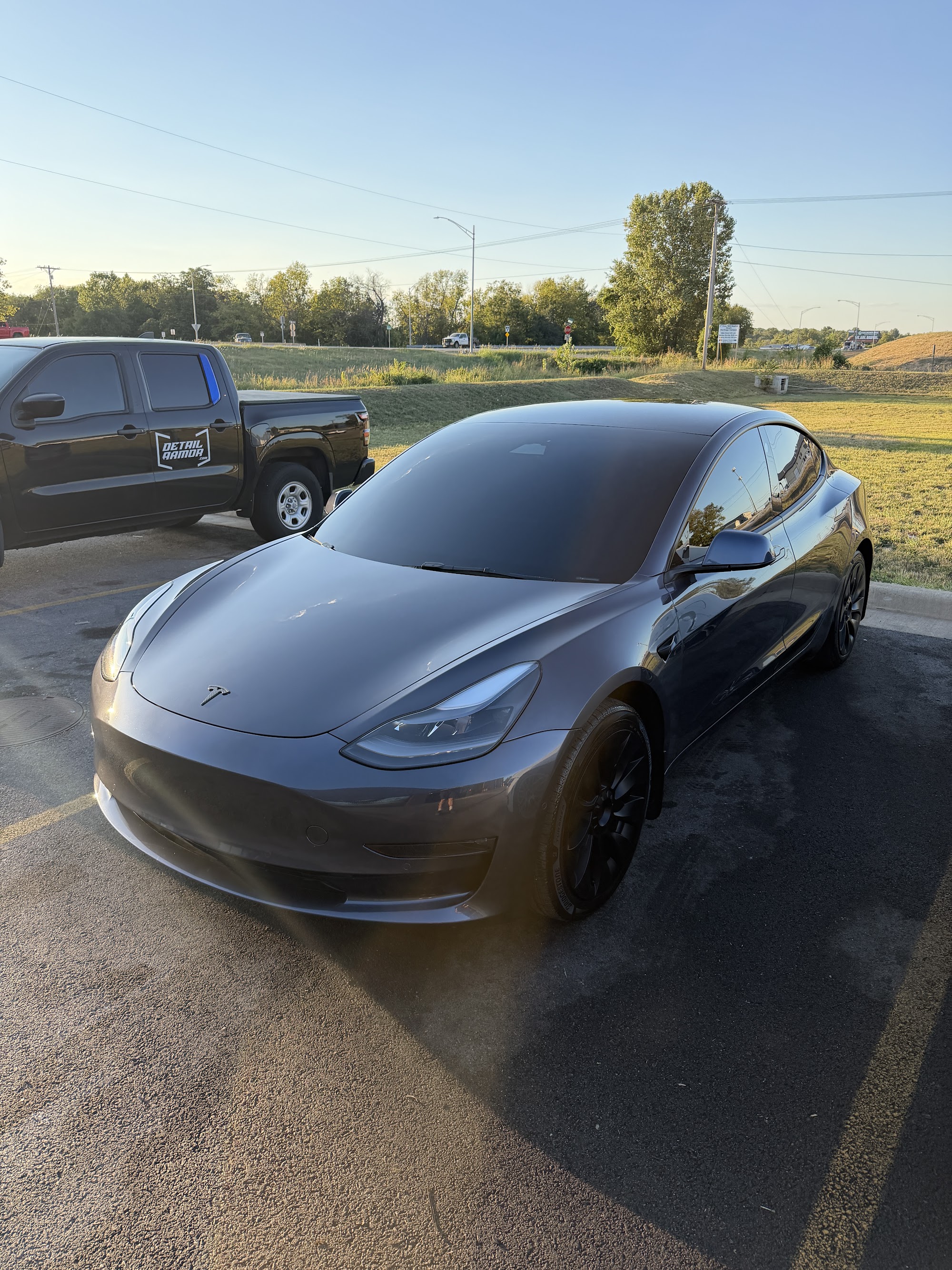 Gray Tesla Model 3 with window tint, a two-stage paint correction and a ceramic coating