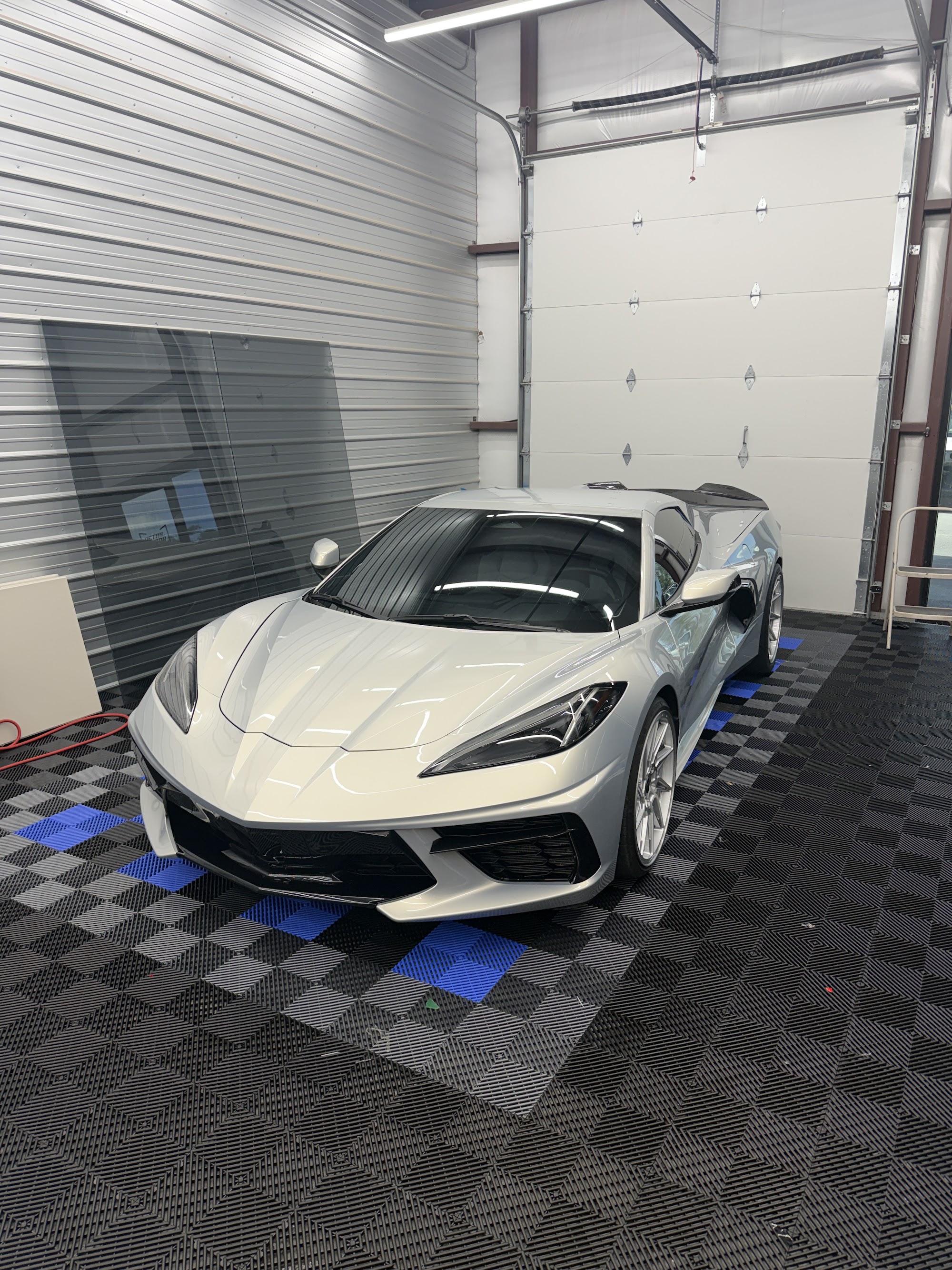 Silver Corvette C8 with full body paint protection film, ceramic coating and window tint by Detail Armor
