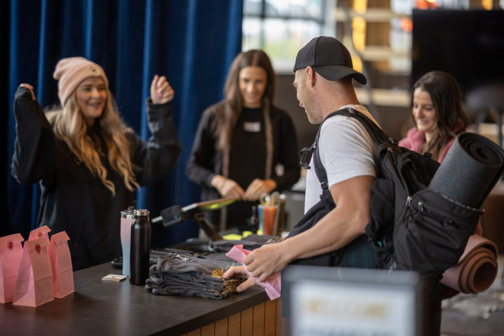 Professional event staff coordinating a fitness activation