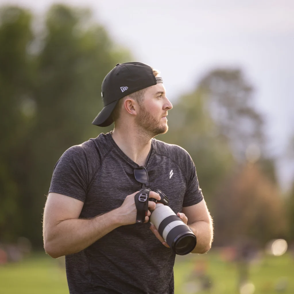 Photographer capturing a fitness event for photo and video coverage
