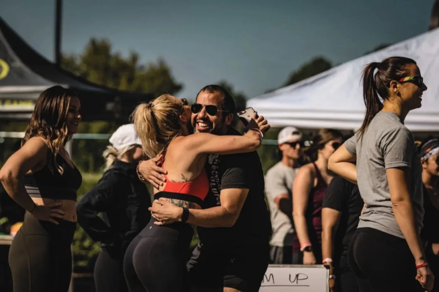 Attendees hugging after a class