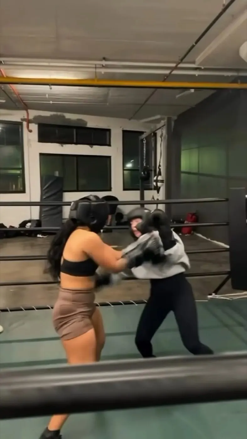 Two boxers sparring in the ring