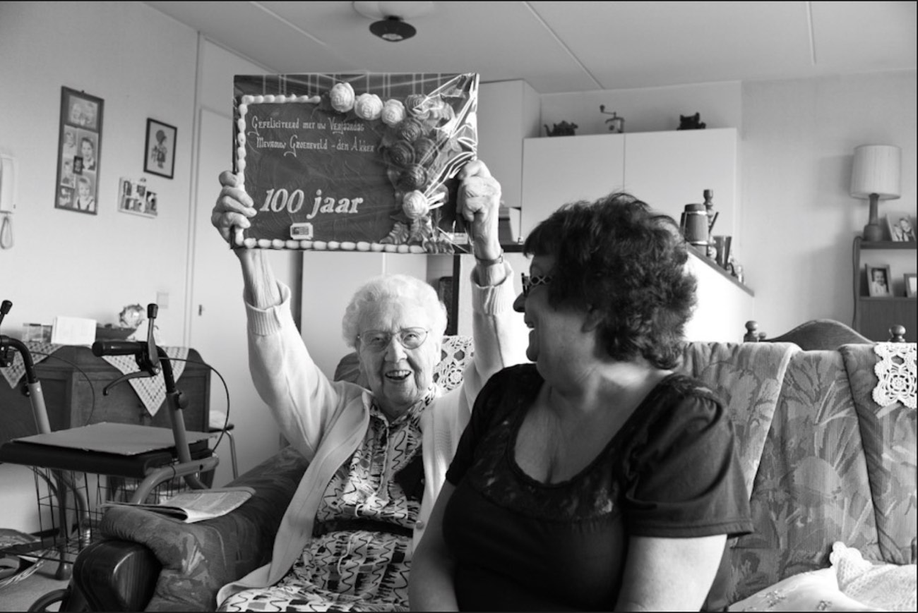 A Buurtzorg nurse celebrating a client's 100th birthday
