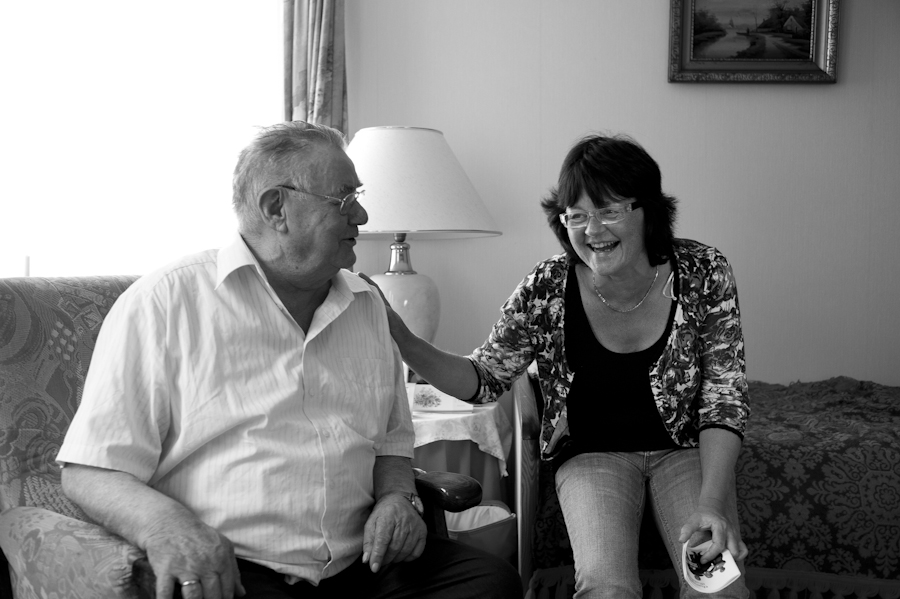 A district nurse laughing with a client