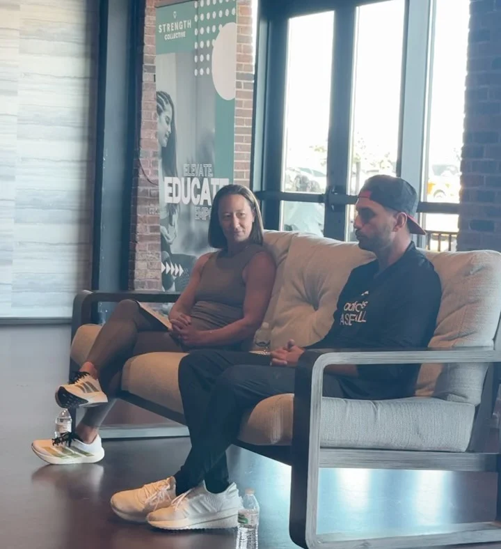 People in conversation in a lounge.