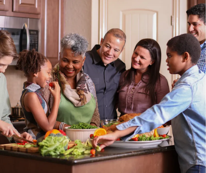 Family gathered around in kitchen during winter time
