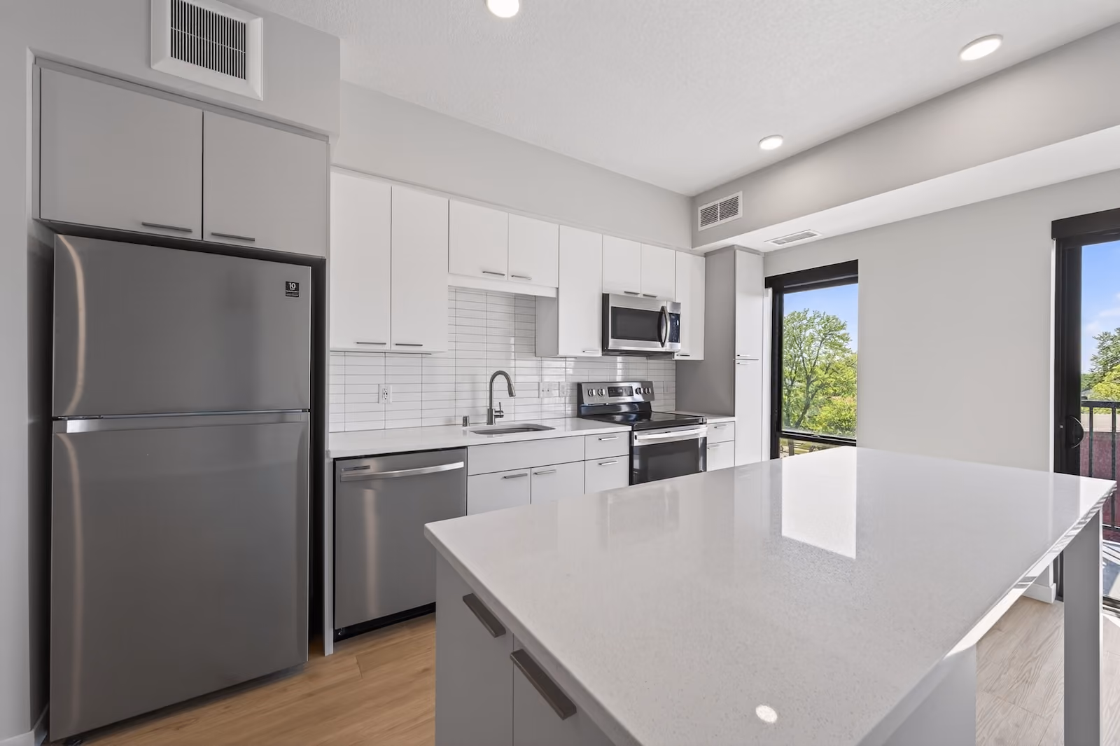 Kitchen with quartz countertops at The Pitch Apartments