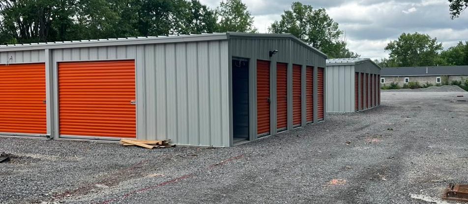 Open gravel lot and storage units at HJ Storage