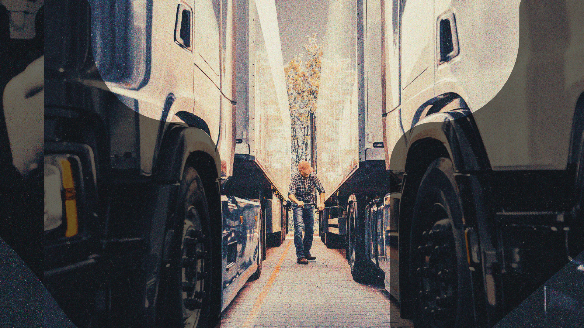 Driver walking between parked fleet trucks