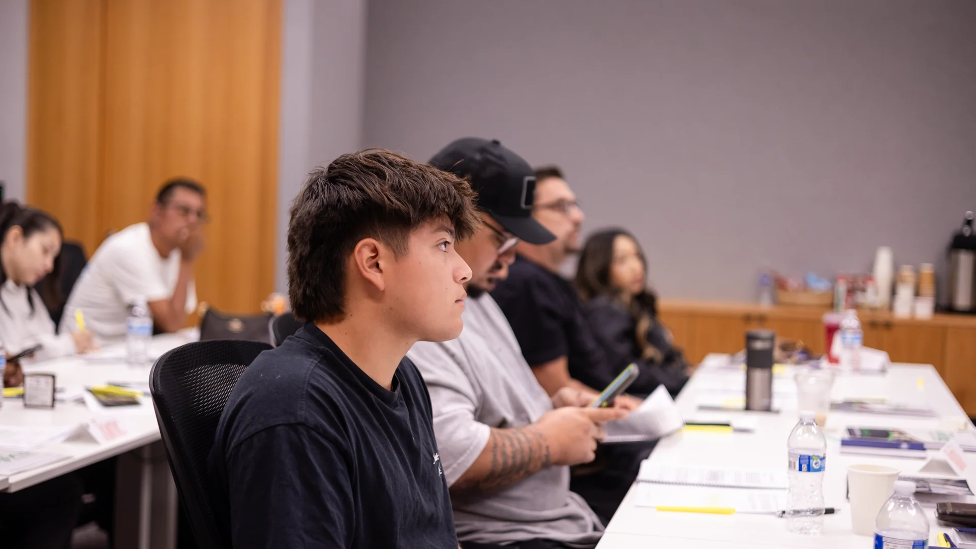 Students listening closely during a public adjuster exam prep class