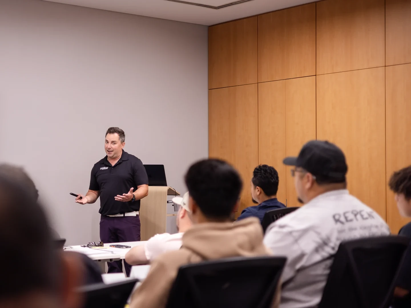 Instructor talking with students during an Indiana public adjuster exam prep class