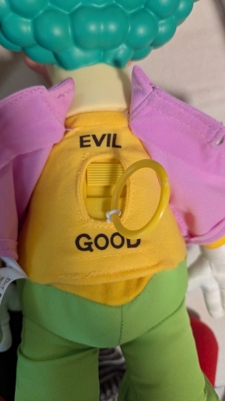 The back of my talking Krusty doll: a switch between EVIL and GOOD, currently pushed to EVIL