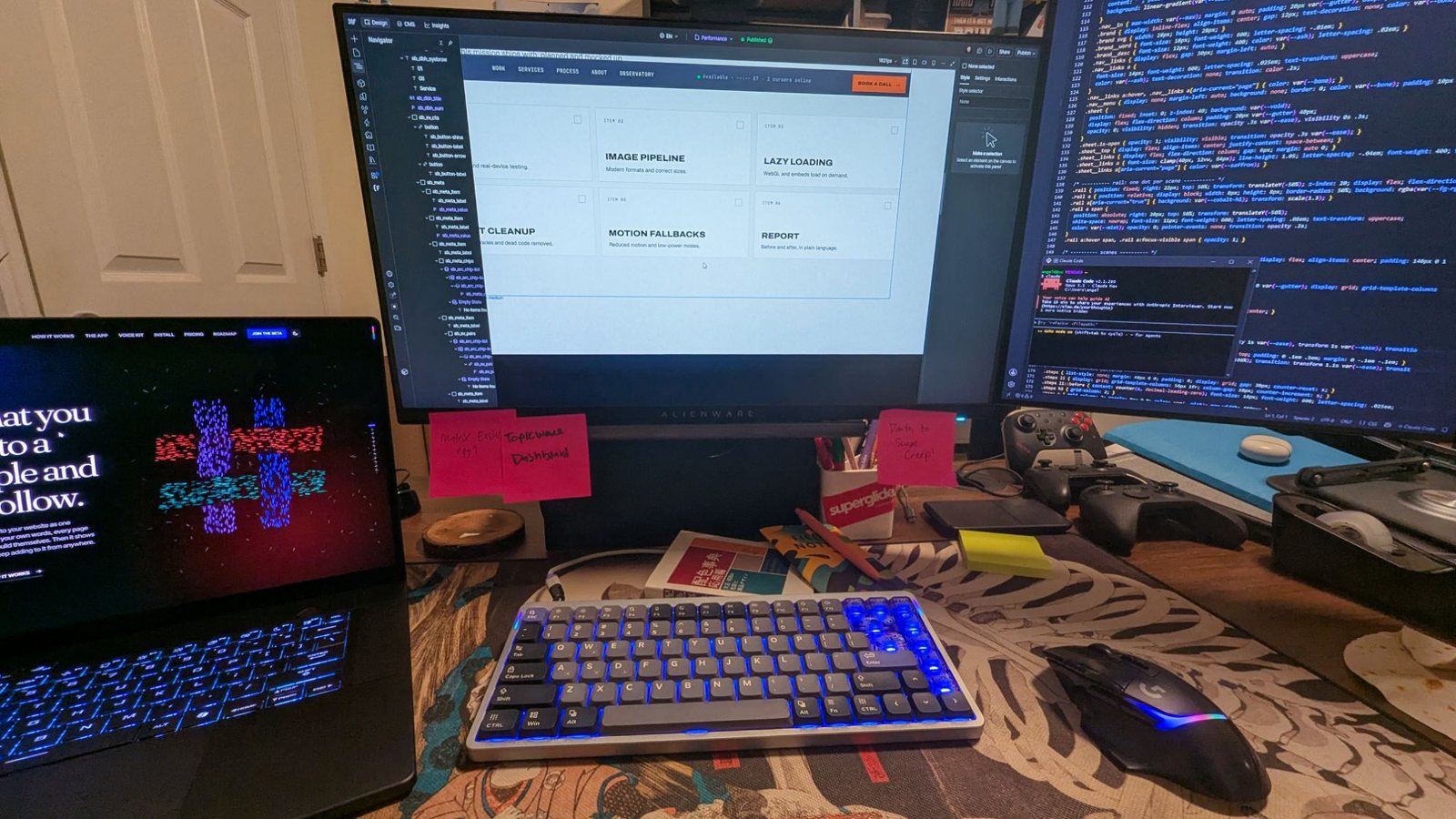 My desk: Topicweave's loom on the laptop, Webflow in the middle, code on the right, and sticky notes that say "Matrix easter egg?", "Topicweave dashboard" and "Death to scope creep!"