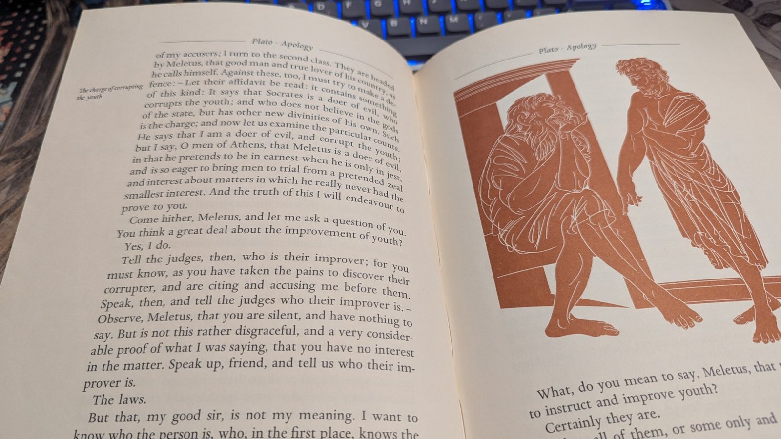 Plato's Apology open on my desk, the text set in justified lines with a note in the margin