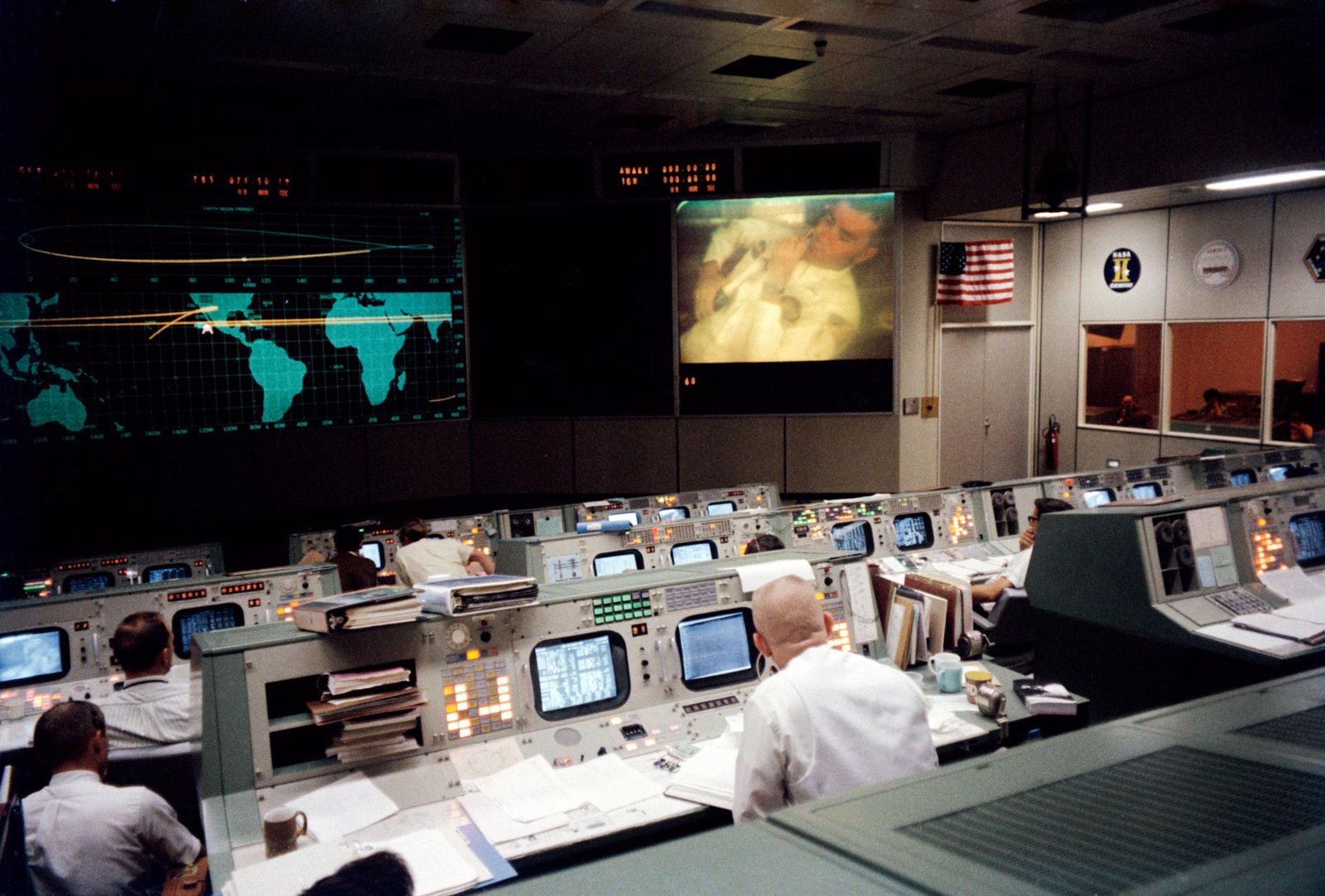 Gene Kranz at his console in Mission Control watching an Apollo 13 TV broadcast, April 13, 1970