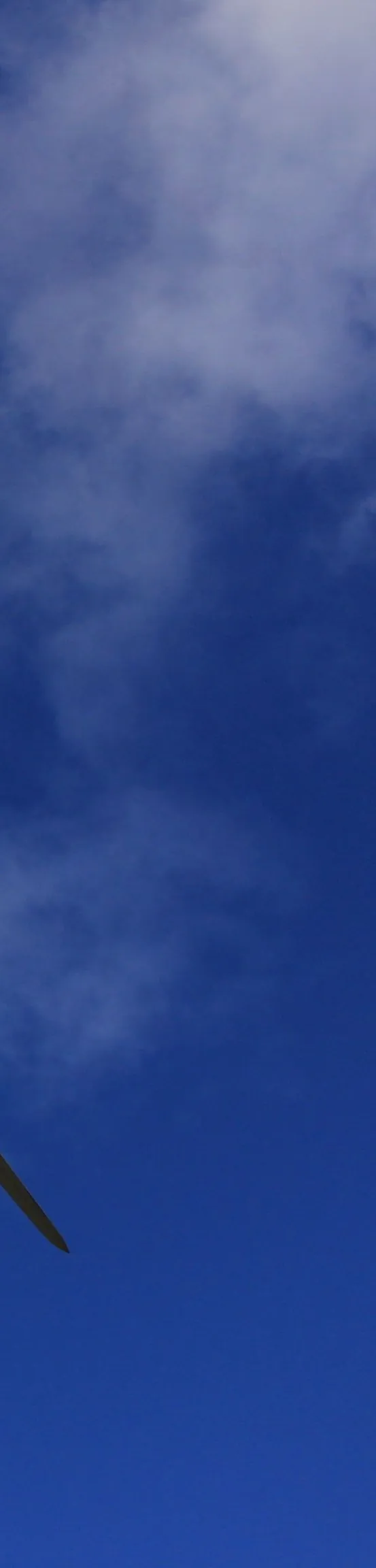 Wind turbine against a blue sky