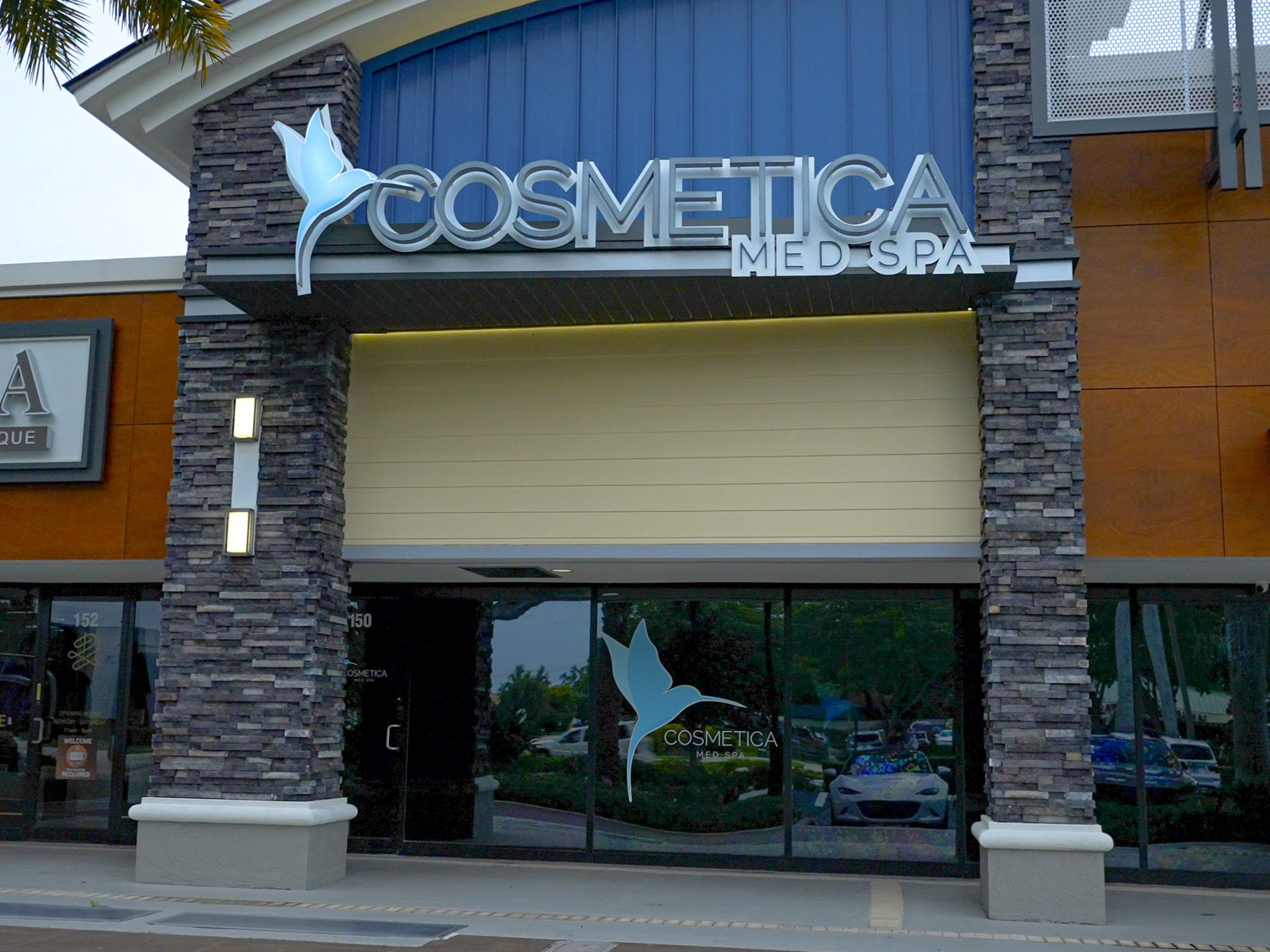 Cosmetica Med Spa storefront and sign in Sanctuary Shoppes, Boca Raton