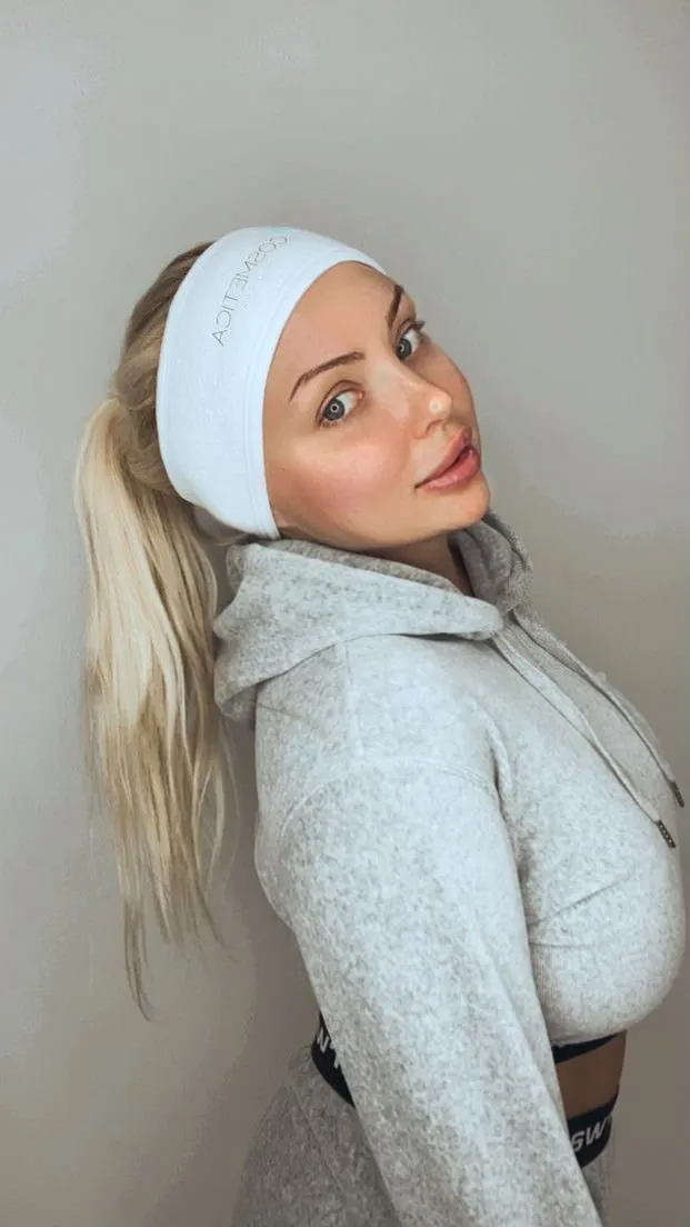 Client wearing a Cosmetica Med Spa headband after a treatment